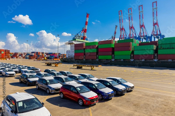 Obraz New Car and Shipping containers being unloaded at port facilities in Ashdod, Israel, Containers ships Loading In Ashdod Ports. Israel