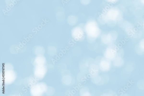 Fototapeta Abstract light blue blur bokeh for background, light blur on high light blue gradient abstract background in central design for presentation.
