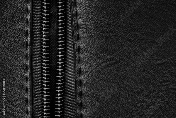 Obraz The lock with a lightning on a black background dissolves.Zipper