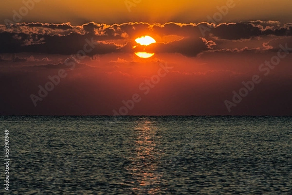 Fototapeta Sun behind clouds