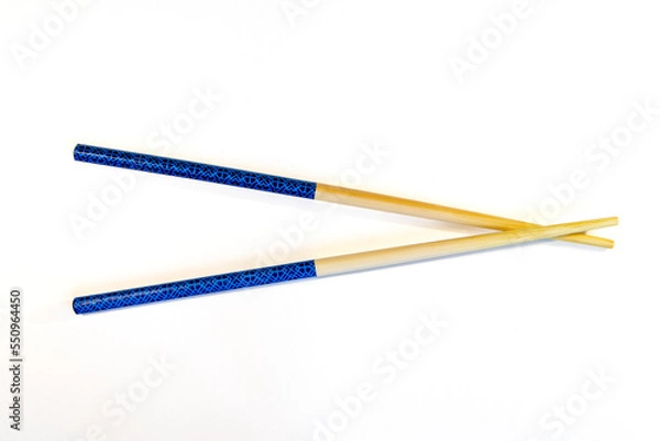 Obraz Two Chopsticks crossed on white background