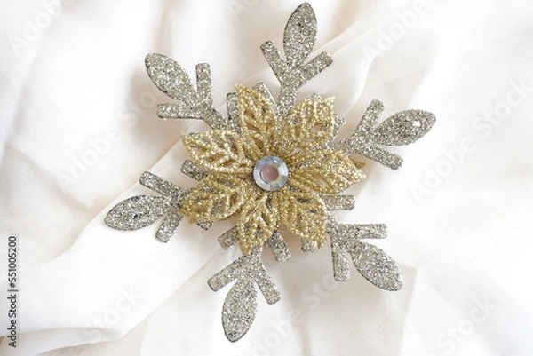Fototapeta Silver gold combination glitter texture snowflake. Isolated on white background. Christmas decoration.