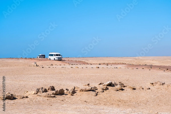 Obraz Tour buses drive through the desert in Ras Mohammed national park. Beautiful landscape in Sinai peninsula in Egypt.
