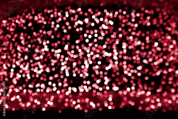 Fototapeta Defocused  abstract  bokeh. Festive lights. Viva Magenta - trendy color of the year 2023.