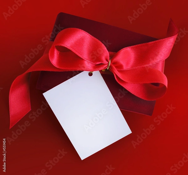 Fototapeta present with red ribbon and card.
