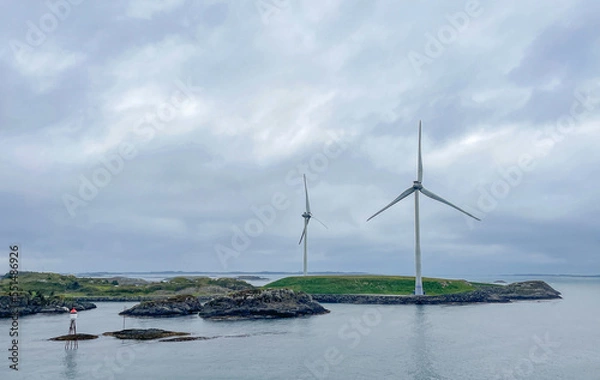 Fototapeta Wind turbines in the Norwegian fjords on a cloudy day