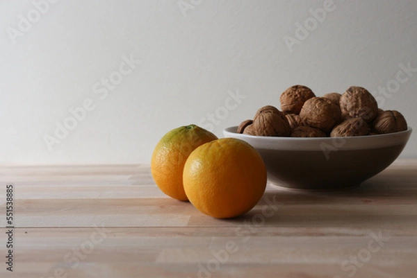 Fototapeta Walnuts and oranges