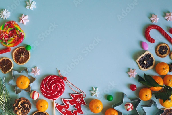 Obraz Christmas or New Year composition with candy cane, fir branch and tangerines
