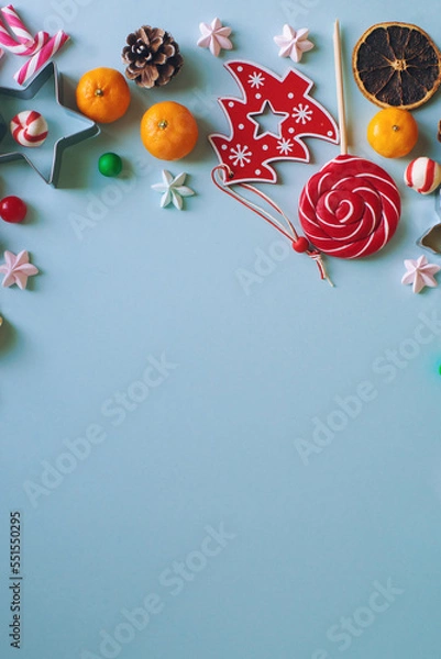 Obraz Christmas or New Year composition with candy cane, fir branch and tangerines