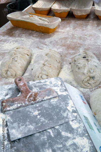 Fototapeta Bakery counter with special raw breads to be baked