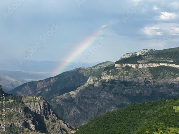 Fototapeta Rainbow over a mountain valley in Armenia