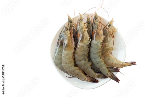 Fototapeta Top view of raw shrimps or fresh prawns in white plate for cooking isolated on white background included clipping path.