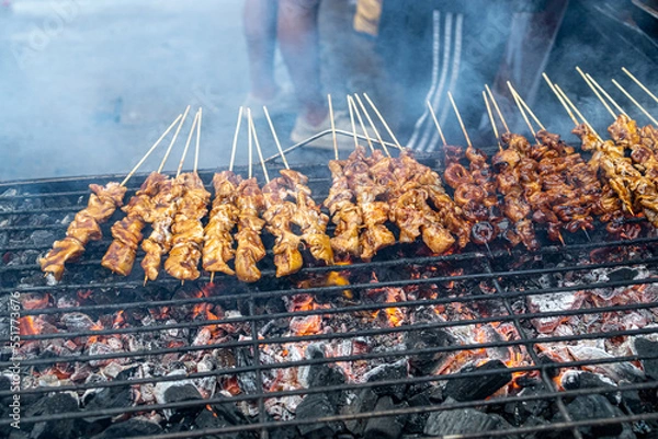 Fototapeta Popular Filipino street food Pork and Chicken barbecue