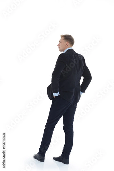 Fototapeta back view. business man reading an ad on a white screen .