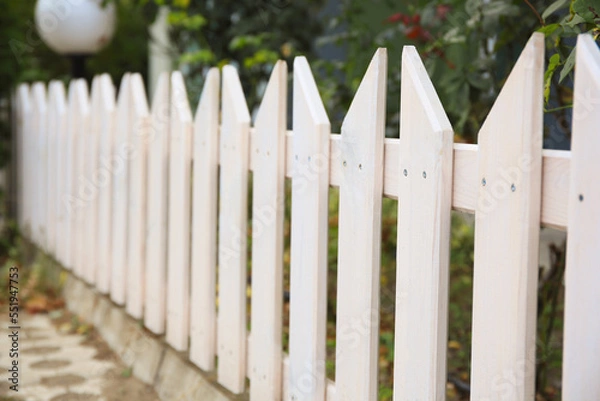 Fototapeta Closeup view of small wooden fence outdoors, space for text