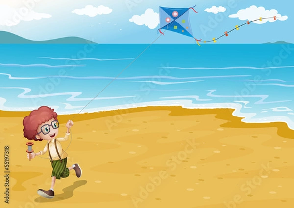 Fototapeta A beach with a boy playing