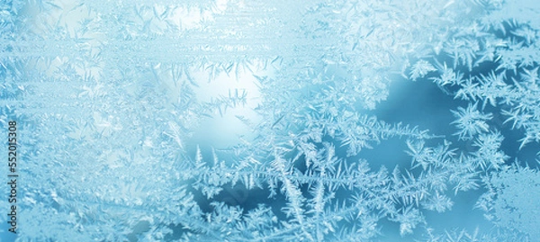 Obraz frost on blue glass window background