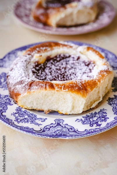 Fototapeta raspberry and blueberry cbrioche bun with custard and cranberries