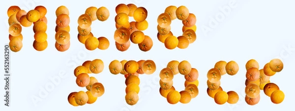Fototapeta 
Text showing the word "microstock" made of oranges, mandarines and tangerines. Slogan concept. Seasonal first fruits. Top view, flat lay, copy space, banner.