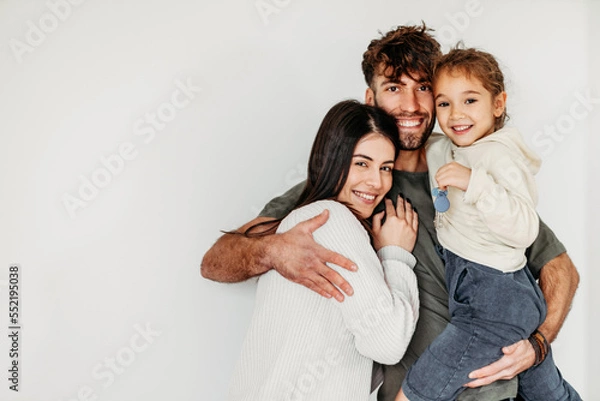 Fototapeta Portrait of Happy Caucasian family in their new empty home