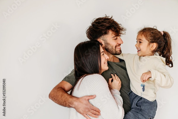 Fototapeta Portrait of Happy Caucasian family in their new empty home