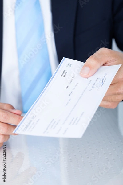 Fototapeta Businessman Holding Cheque