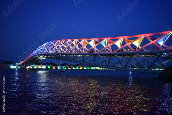 Obraz Atal Pedestrian Bridge, a foot-over bridge on Sabarmati river, night view, in Ahmedabad, Gujrat, India..