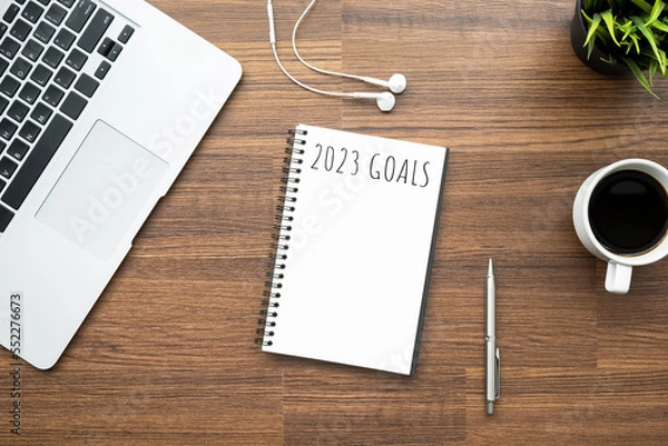 Fototapeta Notebook with 2023 goals text on it to apply new year resolutions and plan.