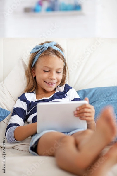 Fototapeta Child playing on tablet pc