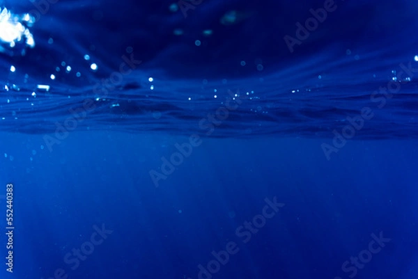 Fototapeta The blue ocean from just unterneath the surface