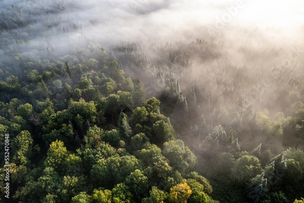 Obraz Aerial image of US - Canada border bathed in mist and fog