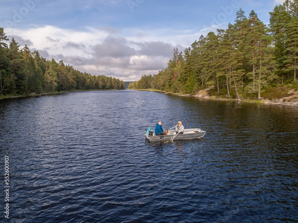 Fototapeta aerial footage couple Kayaking Boat tour on lake Ragnerudssjoen in Dalsland Sweden beautiful nature forest pinetree