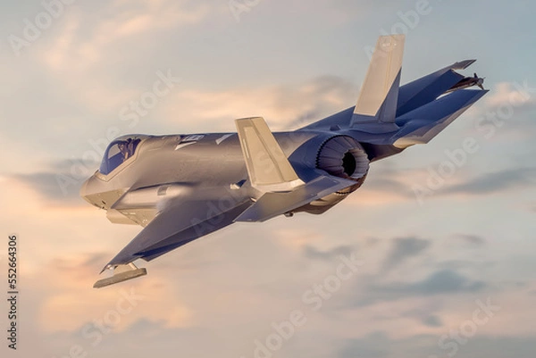 Fototapeta F35 modern fifth generation Fighter jet flying over with missiles on way to combat mission. Modern fighter jets and Airforce pilots on deployment for air defence sunset sky dramatic NATO jet