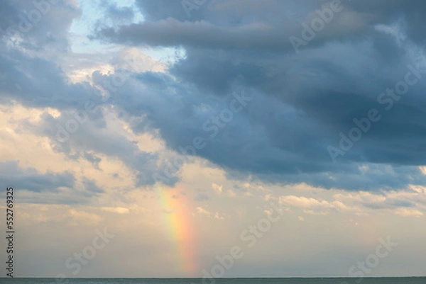 Obraz rainbow on the sea in cloudy weather