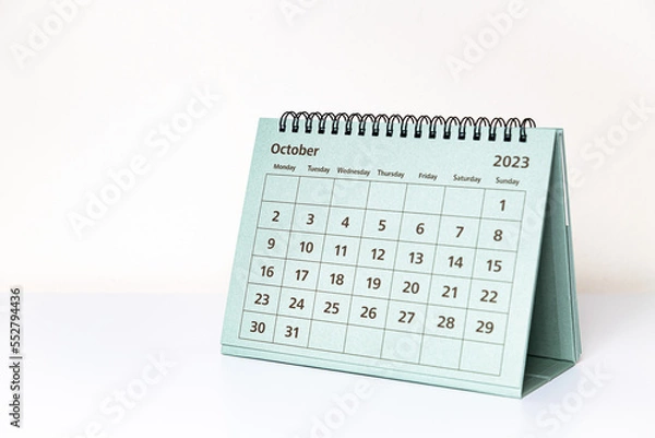 Fototapeta October 2023 calendar on white table. Month page
