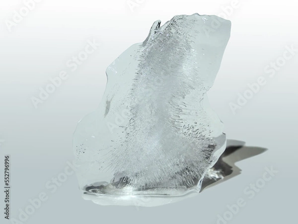 Fototapeta Abstract shape ice sculpture with bubbles inside isolated on white greenish background melting slowly.