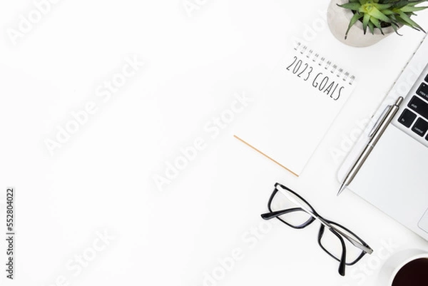 Fototapeta Notebook with 2023 goals text on it to apply new year resolutions and plan.