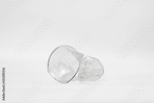 Obraz plastic cup crumpled in a white background