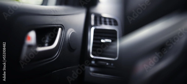 Fototapeta The process of choosing climate control in the car. Various controls in auto switches. Modern car interior