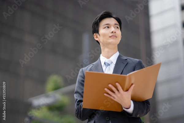 Obraz ファイルを持つビジネスマン