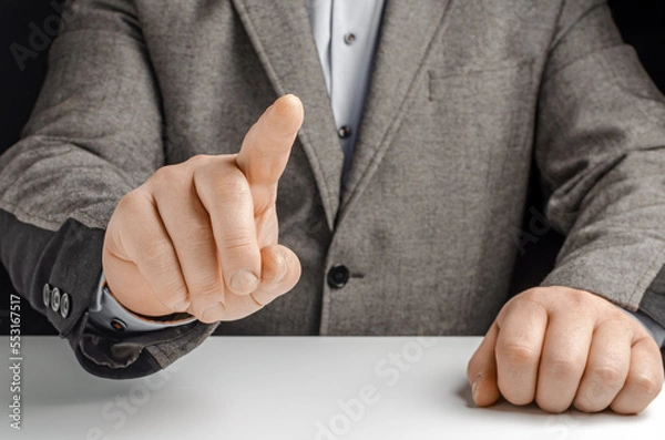 Obraz Businessman in a suit pointing with his finger
