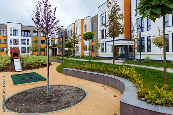 Obraz Green recreation area in the courtyard of a multi-storey building