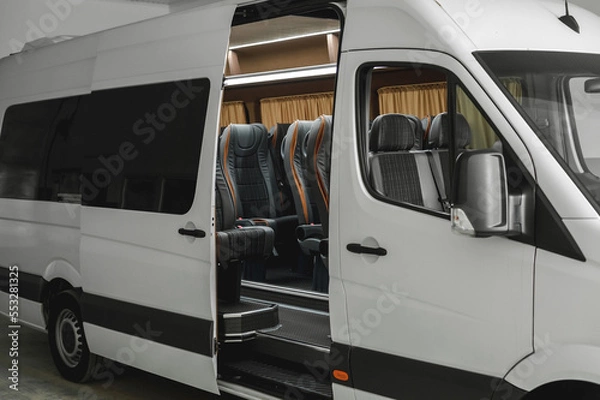 Fototapeta comfortable passenger bus interior with upholstered seats; individual transfer for a group of people; conversion of the interior of a truck; 