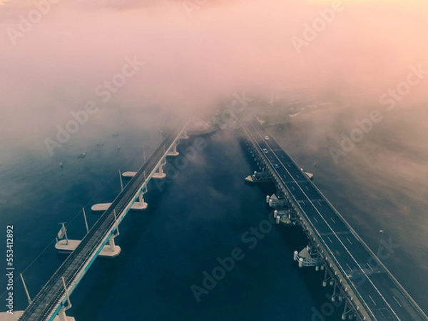 Fototapeta A Foggy morning at Fremantle road and rail bridges, Misty swan river from above. 