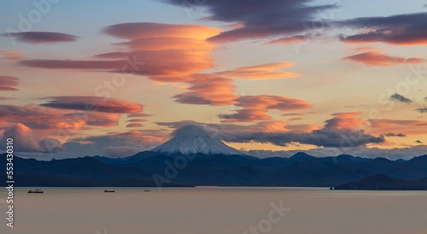 Fototapeta Lenticular clouds over  volcano