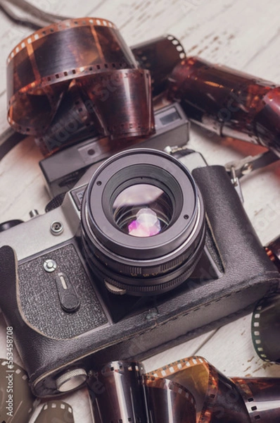 Fototapeta Old retro camera with lens flare