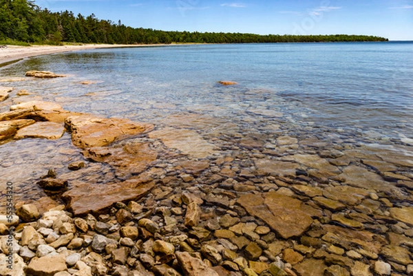 Obraz Rocks line the Lake Michigan Shoreline near the beach of Newport State Park, Wisconsin
