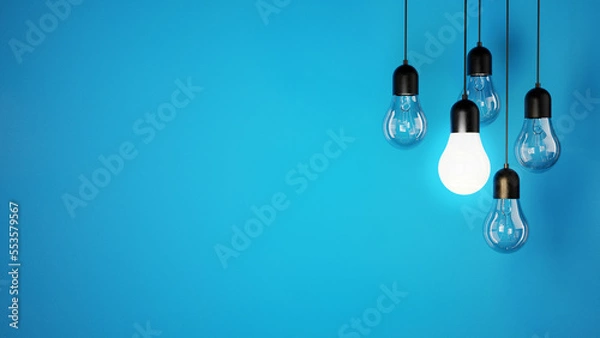 Fototapeta The concept of a light bulbs on blue background, place for text and design, light bulbs background