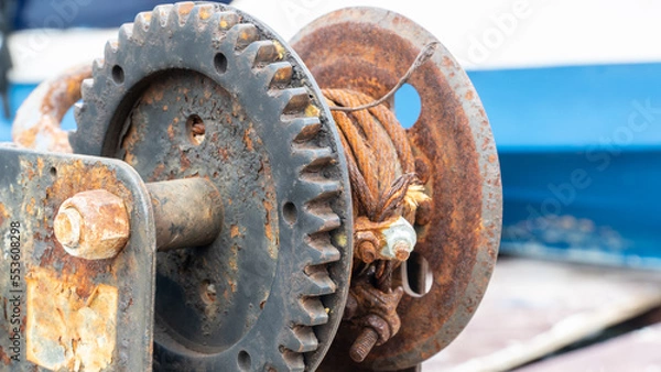 Fototapeta Rusty chains and rope. rope winding machine. nautical instruments. Mooring boat