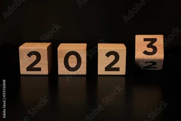 Fototapeta Blocks flipping to 2023 new year